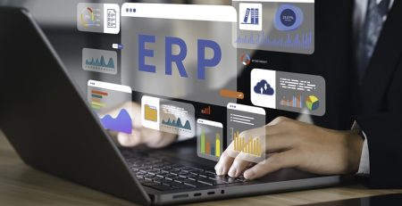 businessman using laptop with erp icon virtual screen enterprise resource planning manage company